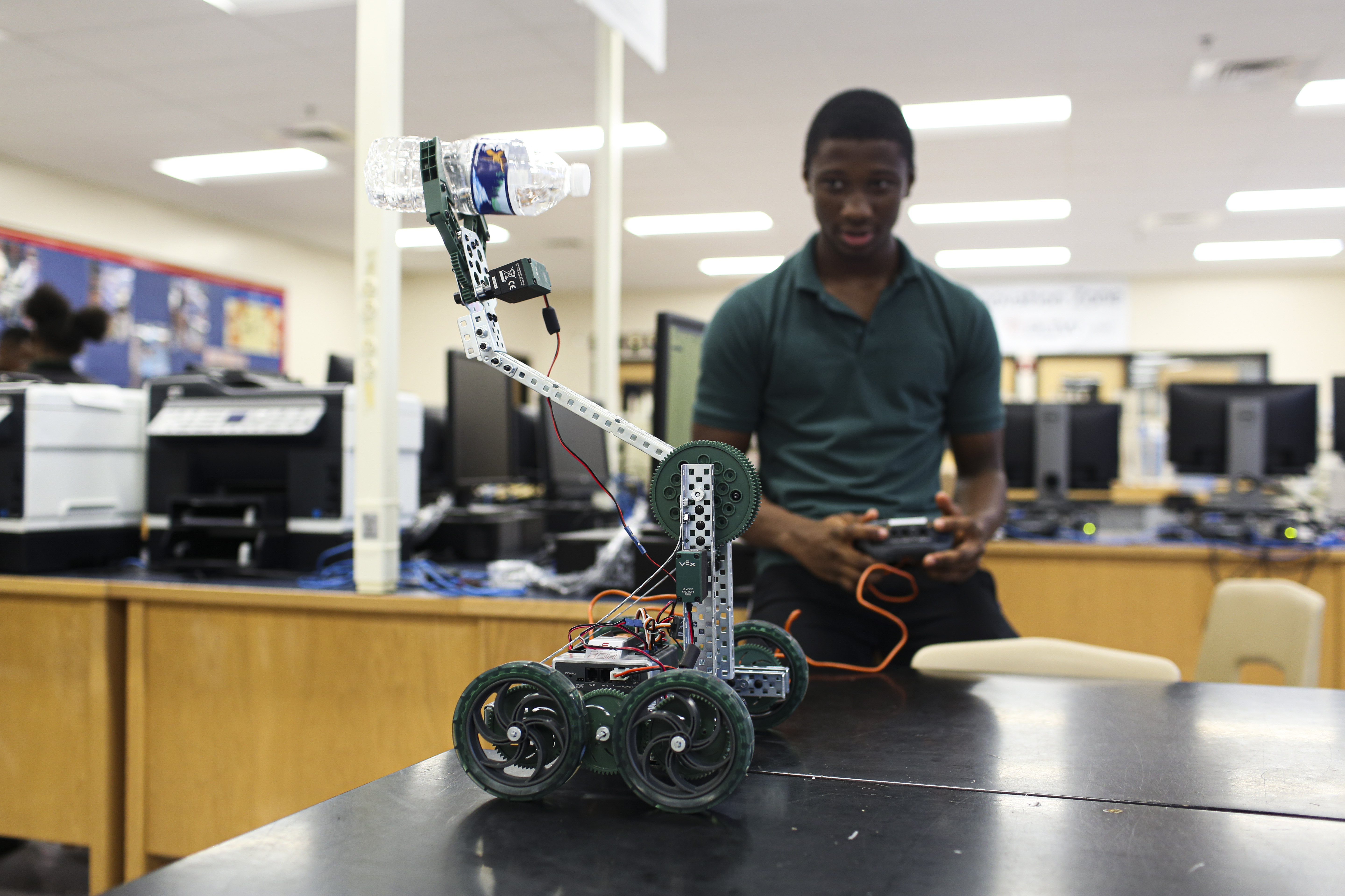 Student shows off his robot.