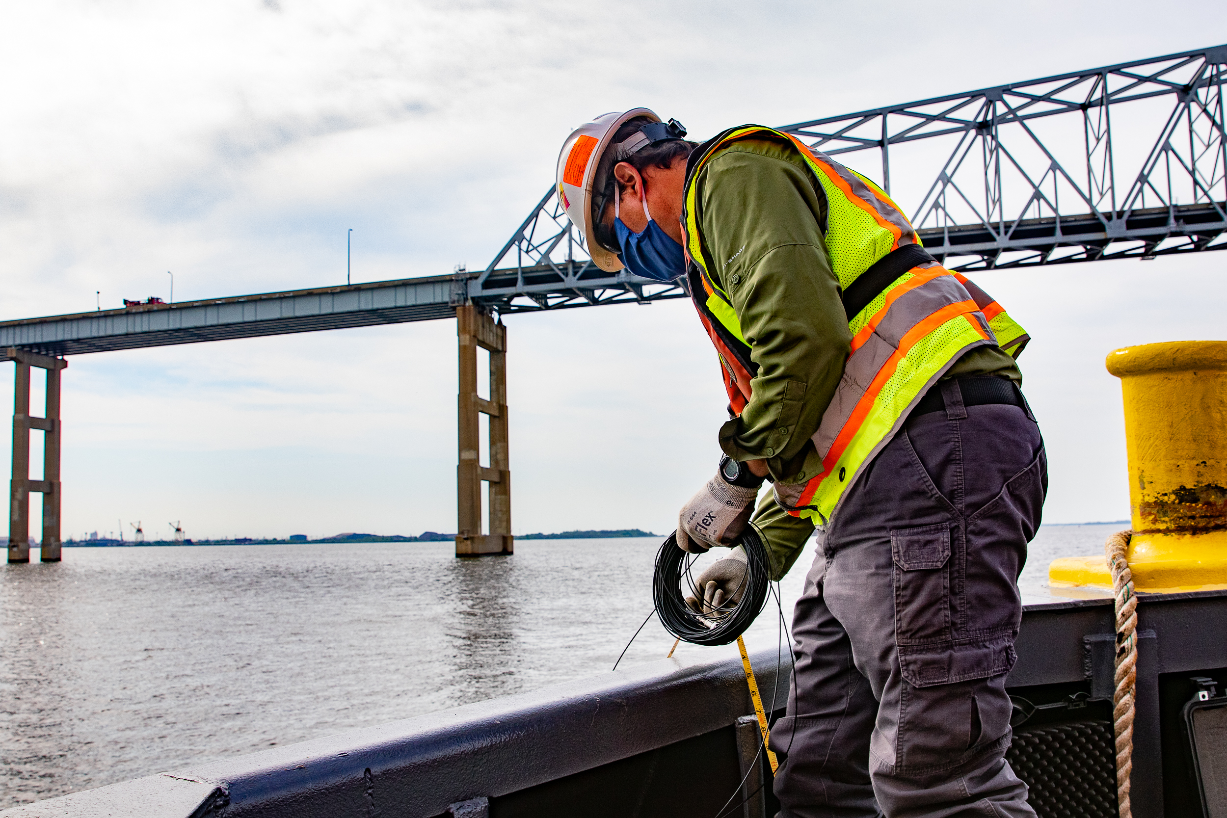 Environmental consultant performs underwater sound monitoring at the Key Crossing construction site