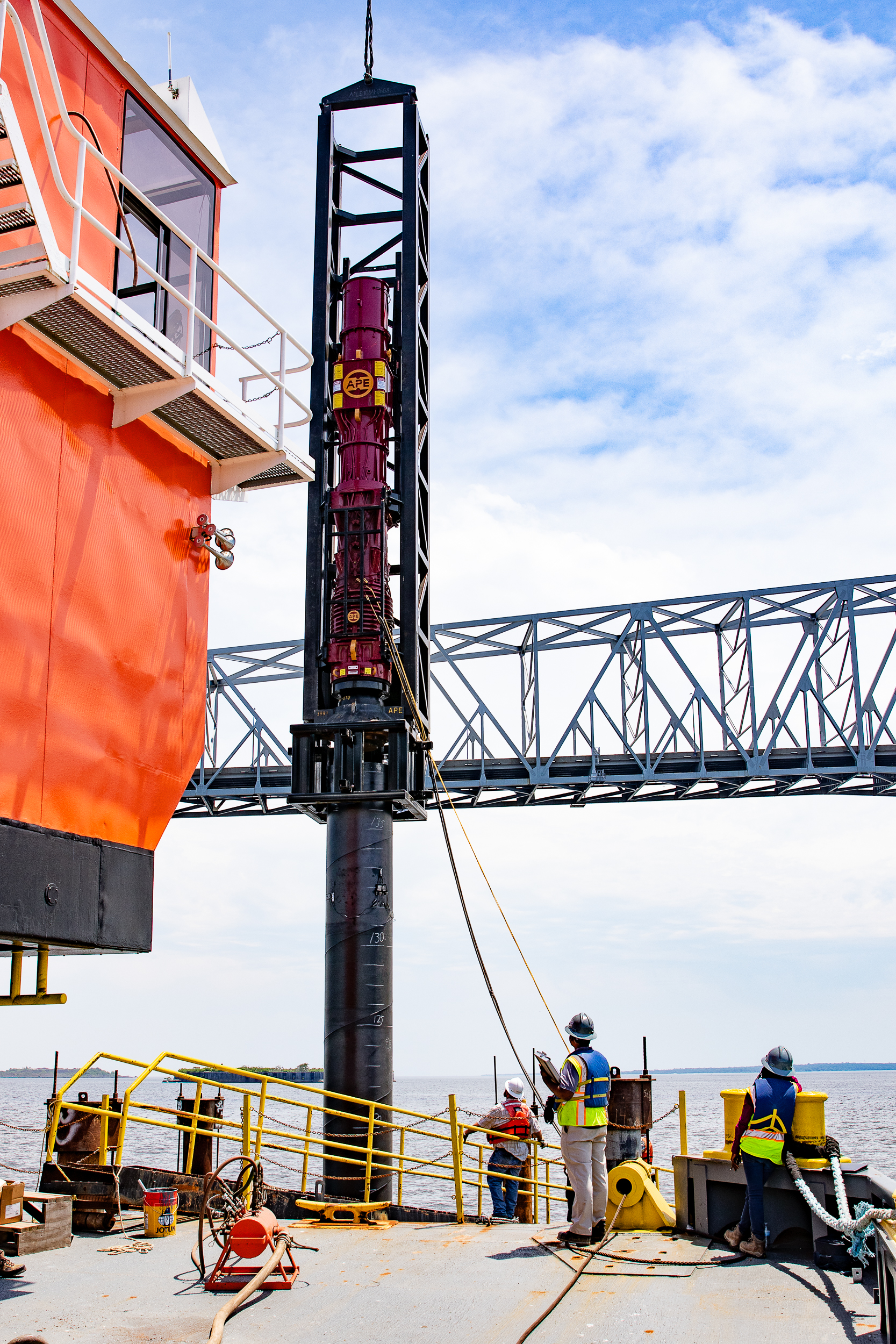 Diesel hammer driving steel pile into Patapsco River