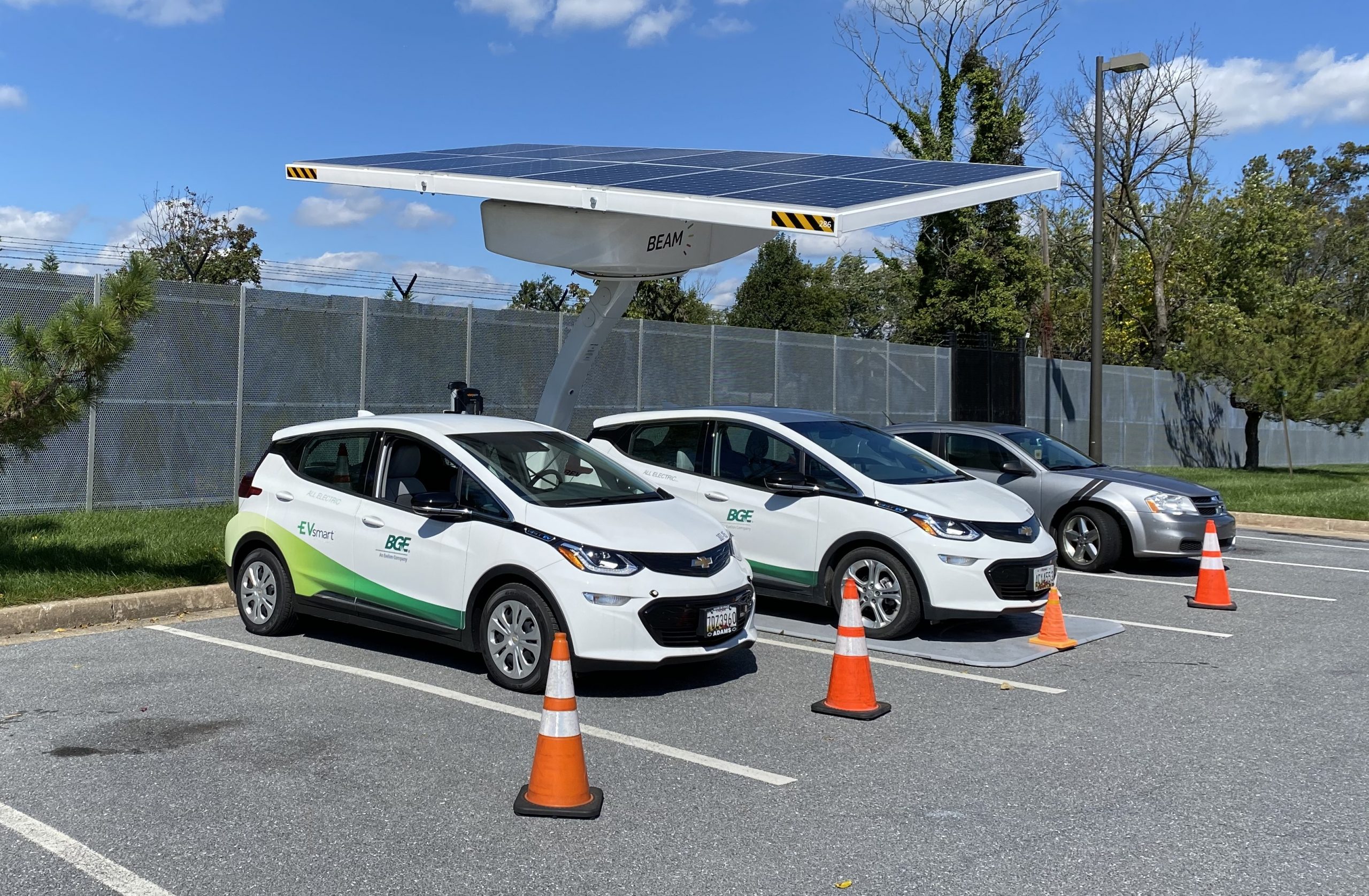 Solar ARC chargers charging two Chevy Bolts