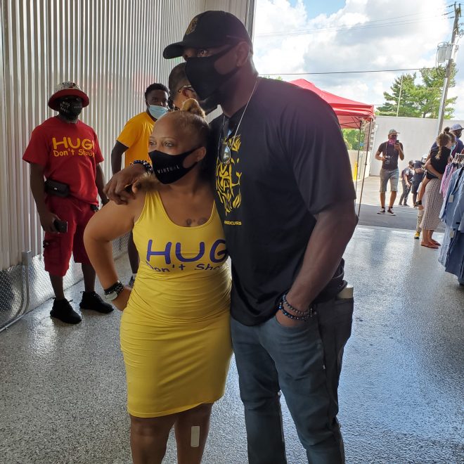 Val Jenkins gets help from Ray Lewis at a recent Hug Don't Shoot event in Baltimore