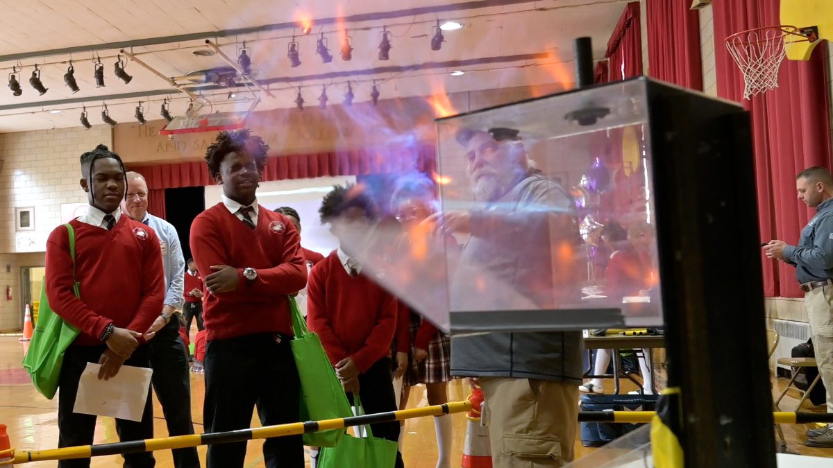 Students safely watch combustion demonstration.
