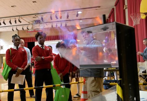 Students safely watch combustion demonstration.