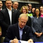 Illinois Gov. Bruce Rauner signs into law the Future Energy Jobs Act on Dec. 7, 2016.