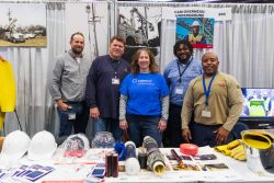 Valerie at a career fair with part of the distribution operations team members.Left to right: Ryan Griffin, Supervisor of Field Operations at ComEd; John Ericson Manager of Regional Operations at ComEd; 