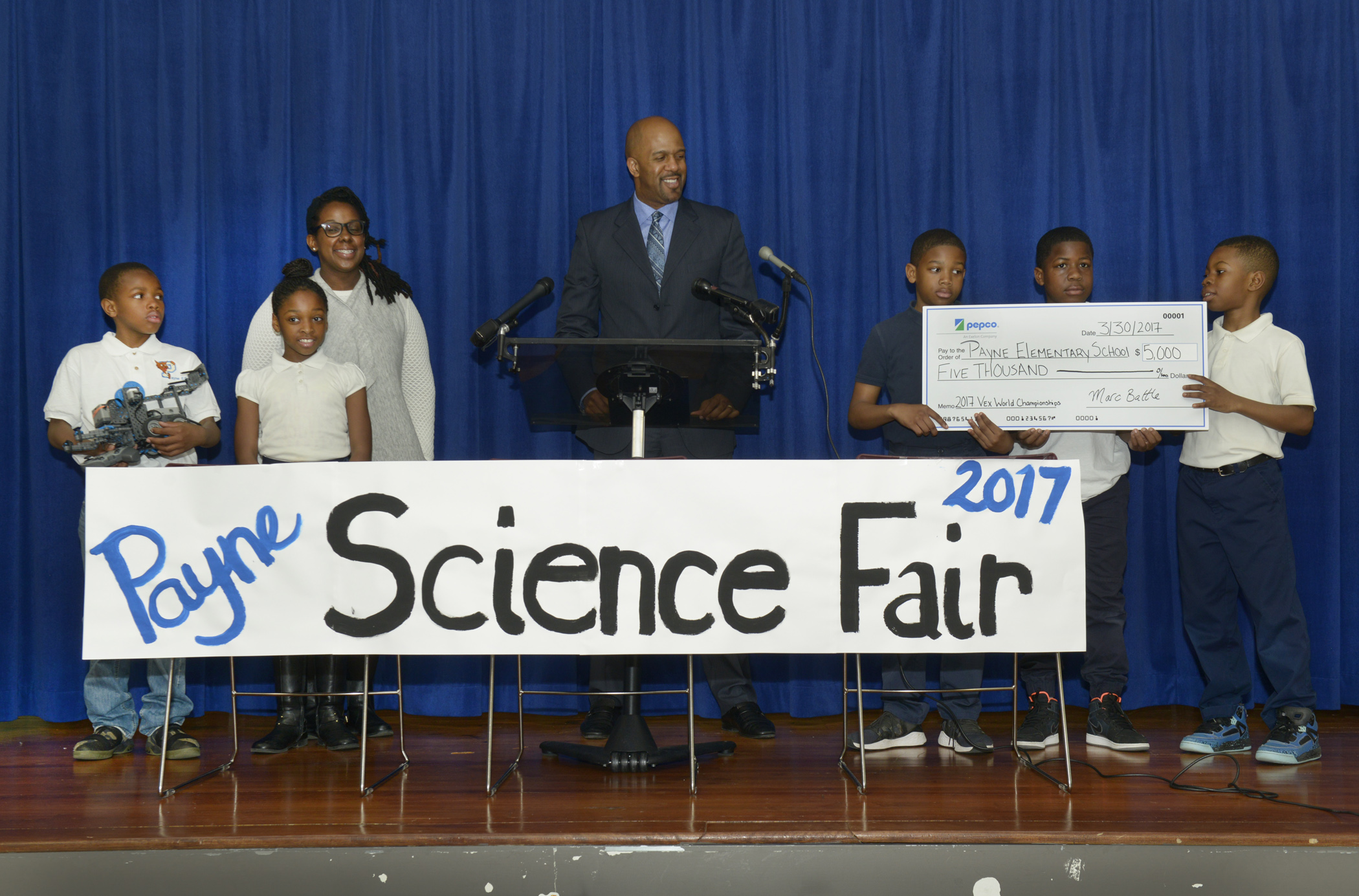 Payne Elementary School Students Stand with Pepco Region Vice President Marc Battle