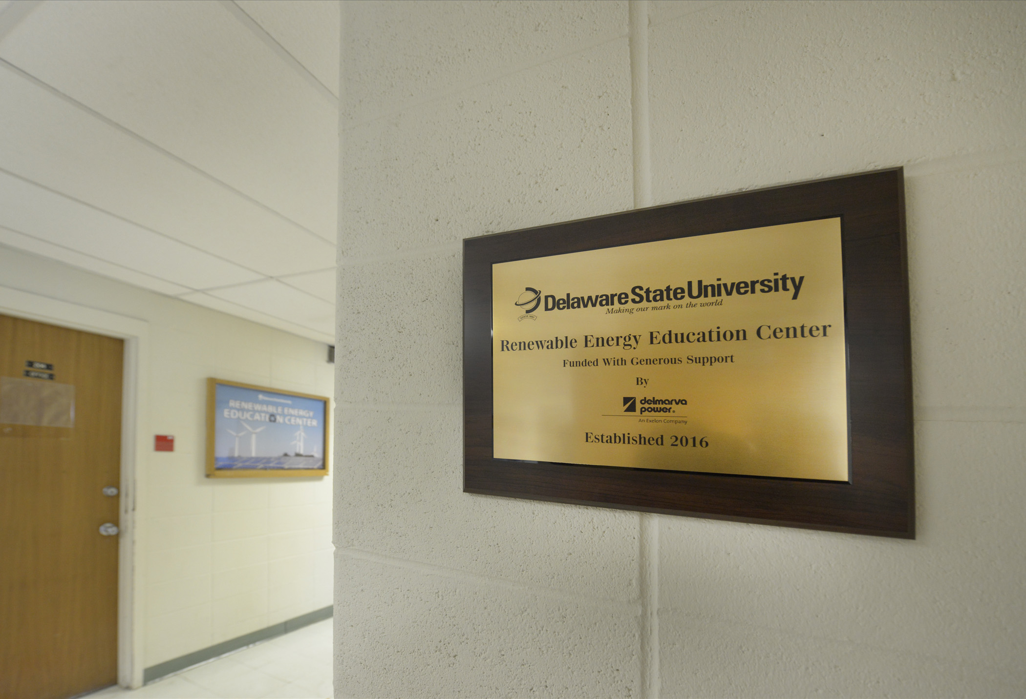 Plaque recognizing Delmarva Power's support of Delaware State University hangs on wall of the Renewable Energy Education Center