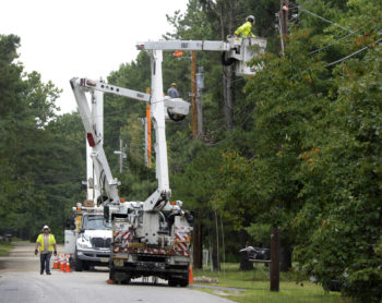 lineworkers fixing wires