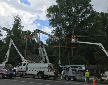 lineworkers fixing wire